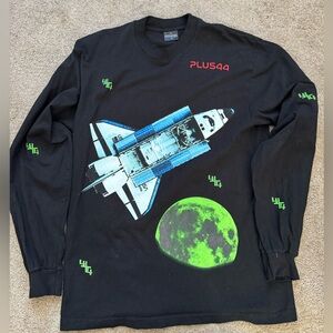 Long sleeve crewneck tee with shuttle and moon graphic on front.
Neon green,